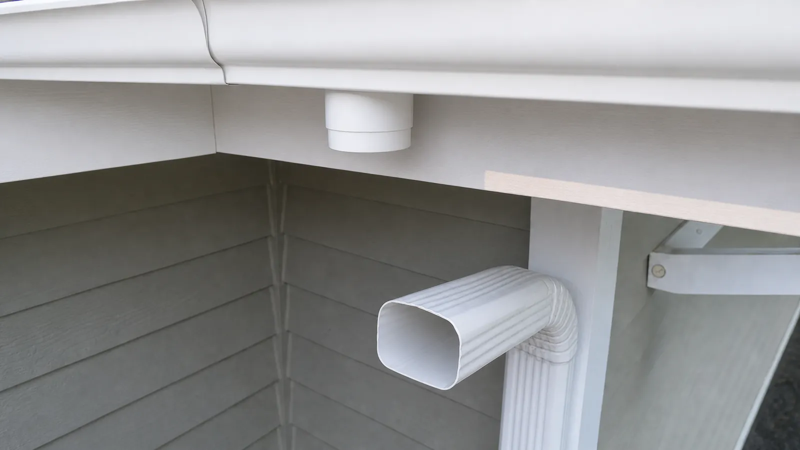 Representative after image of a cleaned downspout outlet